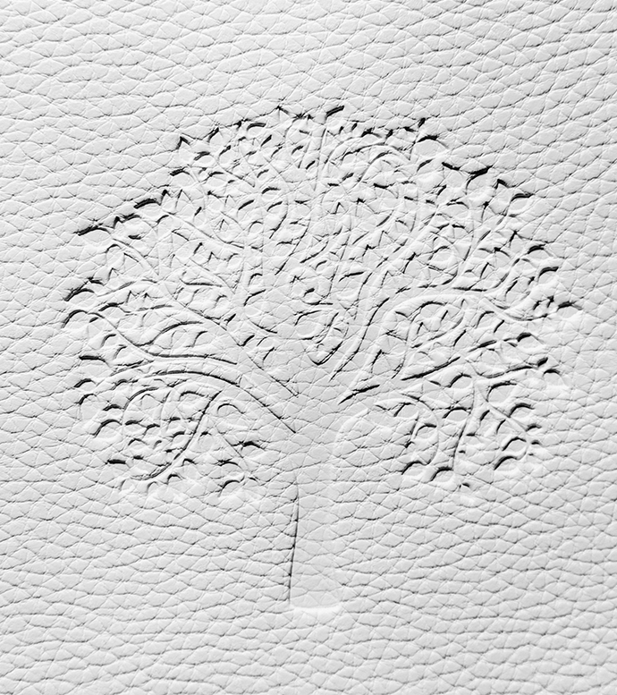 Eleganckie odciśnięcie logo w materiale bez użycia farby. Tłoczenie logo na notesie lub skórze