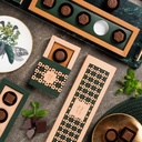 PRALINKA MINT BLISS - praliny z deserowej czekolady (57% kakao) z nadzieniem miętowym i pieczęcią z czekolady mlecznej (33% kakao)