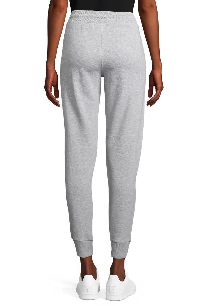 Damskie spodnie dresowe slim z kieszeniami - Grey Melange